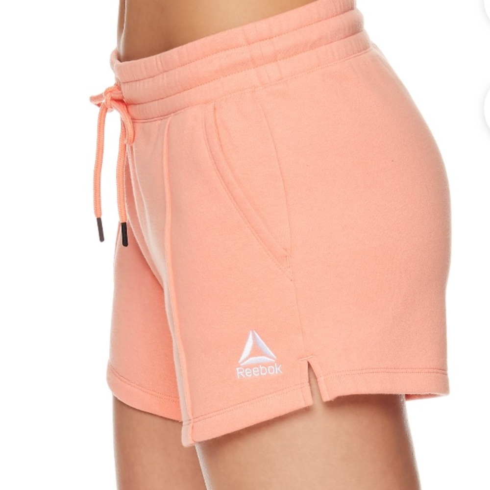 Women’s coral pink Reebok shorts